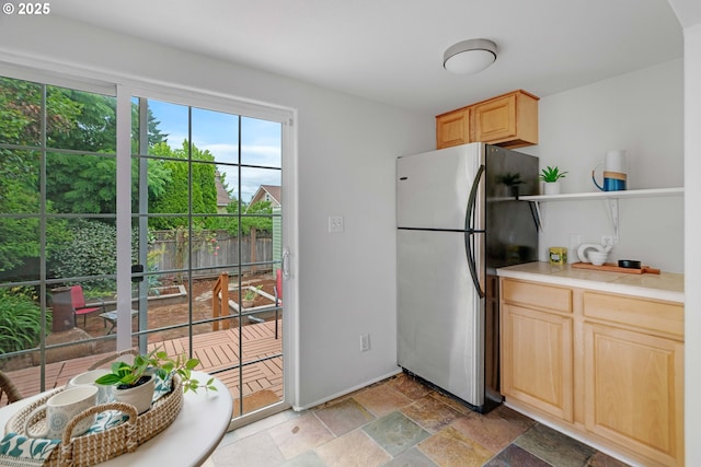 2951 NE 35th Ave, Portland, OR 97212 - kitchen featuring freestanding refrigerator, light brown cabinetry, light stone finish floors, open shelves, and light countertops