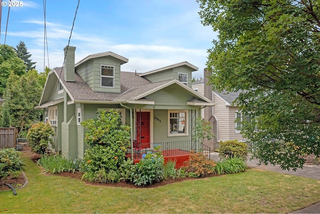 2951 NE 35th Ave, Portland, OR 97212 - view of front of home with a porch, a front yard, roof with shingles, and a chimney