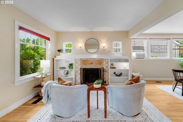 2951 NE 35th Ave, Portland, OR 97212 - living area with wood finished floors and a fireplace