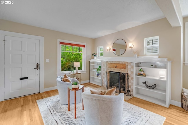 2951 NE 35th Ave, Portland, OR 97212 - living area featuring light wood-style floors and a fireplace