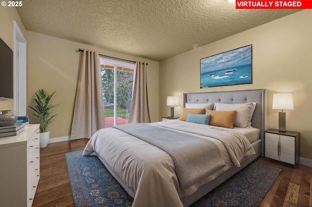 bedroom featuring baseboards, a textured ceiling, and wood finished floors