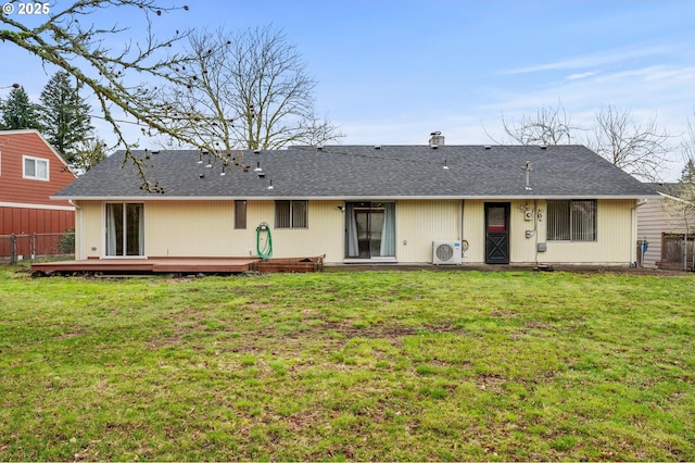 back of house with a deck, ac unit, a yard, and fence