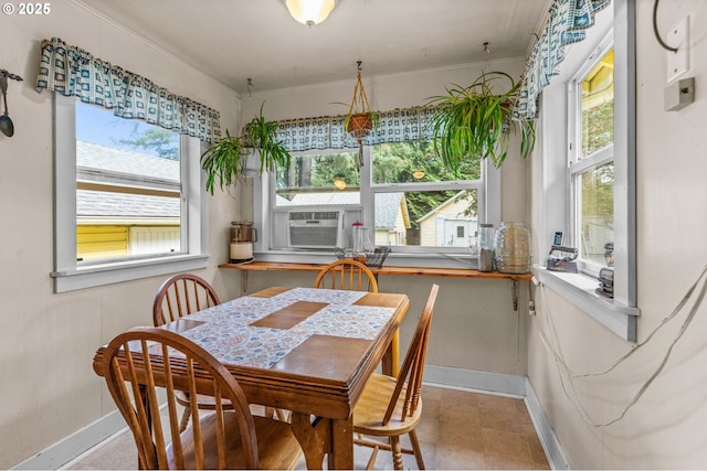 dining area featuring crown molding and cooling unit