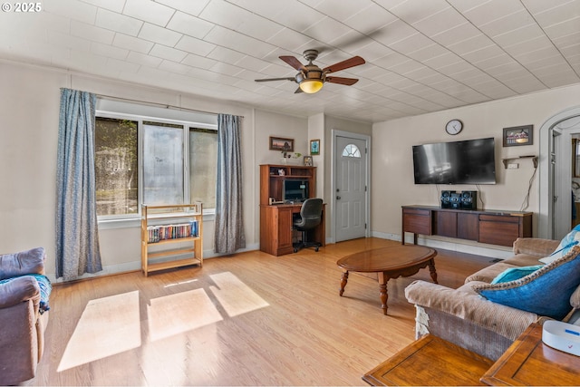 living room with ceiling fan and light hardwood / wood-style floors