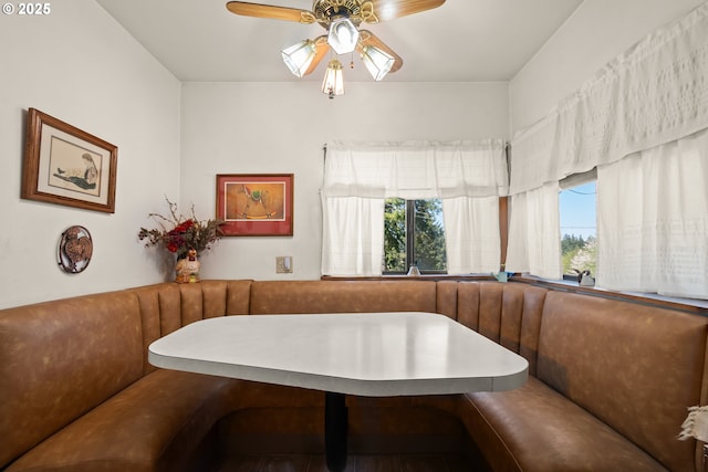 dining room featuring breakfast area and a ceiling fan