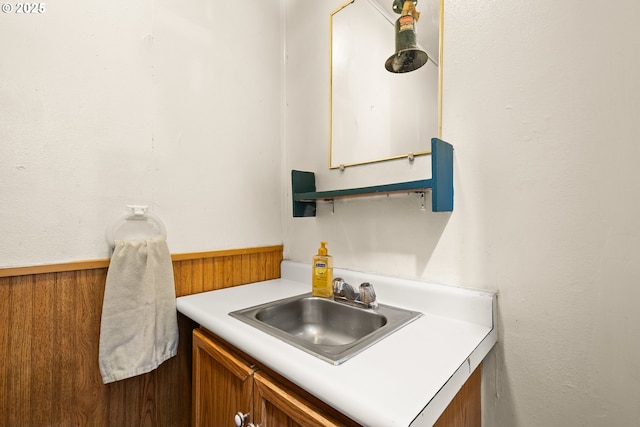 bathroom featuring vanity and wainscoting