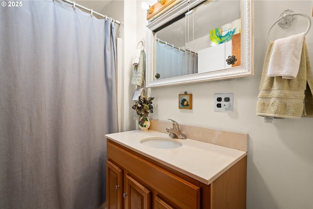 full bath with vanity and a shower with curtain