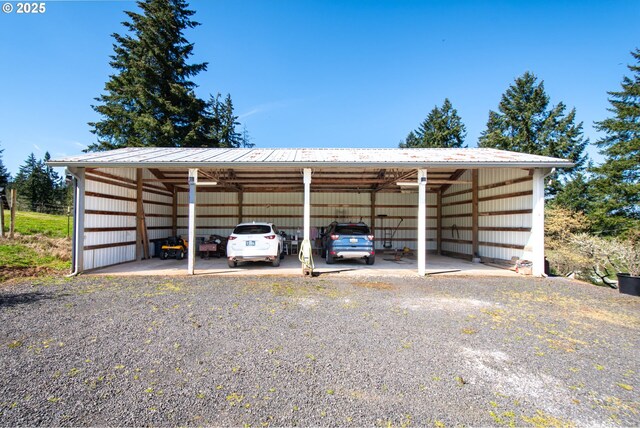 view of parking with an outbuilding and a detached carport