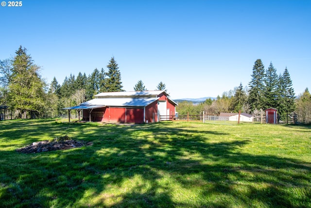 view of yard featuring an outbuilding and a mountain view