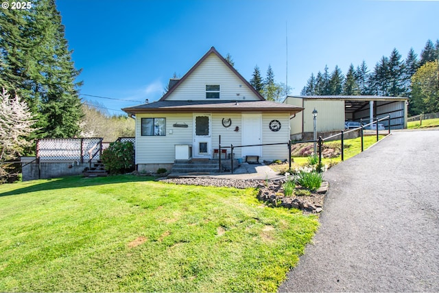view of front of home featuring a carport and asphalt driveway