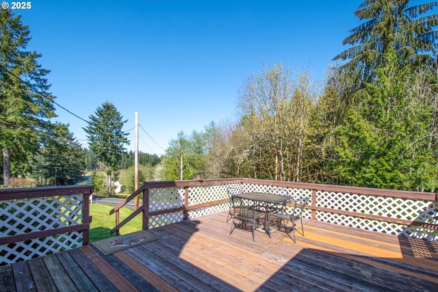 wooden deck with outdoor dining space