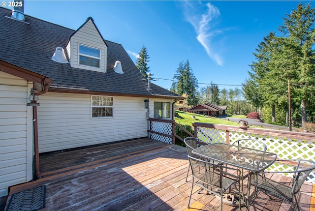 wooden deck with outdoor dining area
