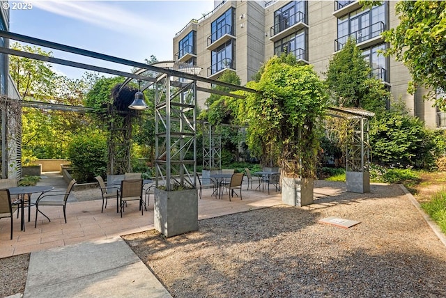 view of patio featuring outdoor dining area