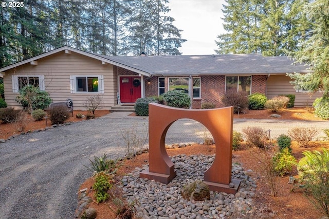 single story home with brick siding