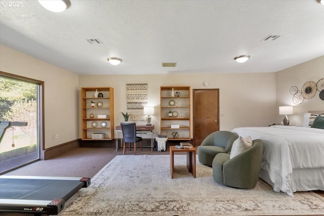 bedroom featuring carpet floors, electric panel, a textured ceiling, and visible vents