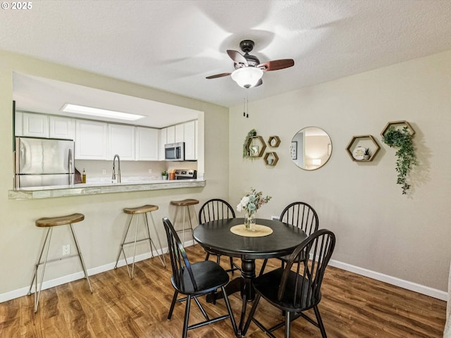 9908 SE Talbert St, Clackamas, OR 97015 - dining room featuring wood finished floors and a ceiling fan