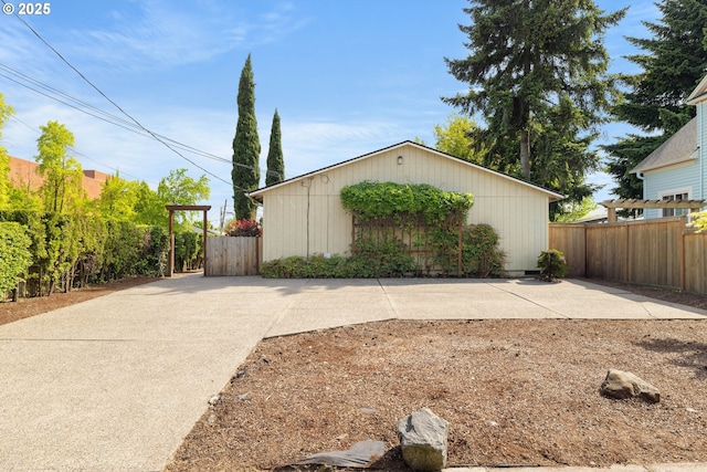 view of home's exterior featuring fence