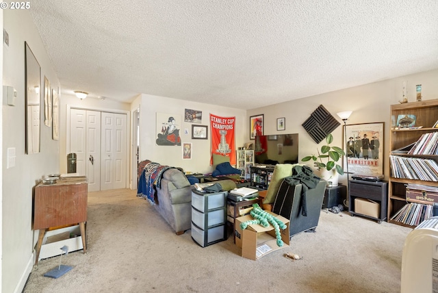 living room featuring carpet flooring and a textured ceiling
