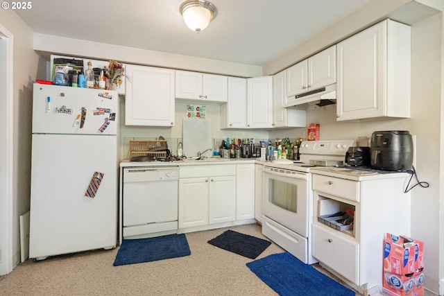 kitchen featuring white appliances, under cabinet range hood, white cabinets, a sink, and light countertops