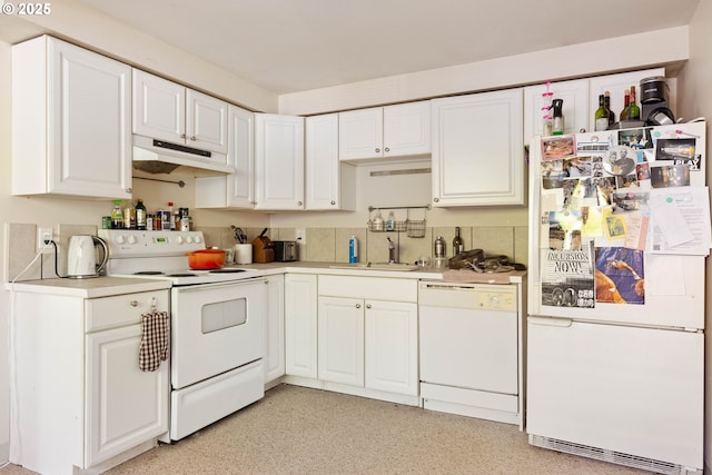 kitchen featuring white appliances, under cabinet range hood, white cabinetry, and light countertops