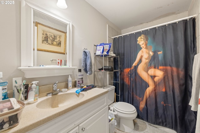 bathroom featuring toilet and vanity