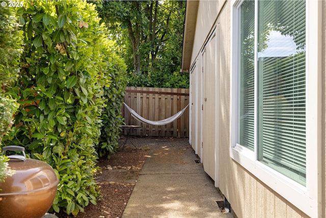 view of home's exterior featuring fence