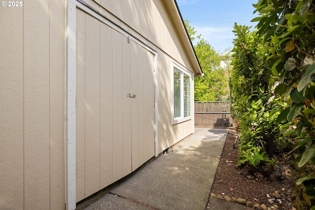 view of property exterior featuring fence