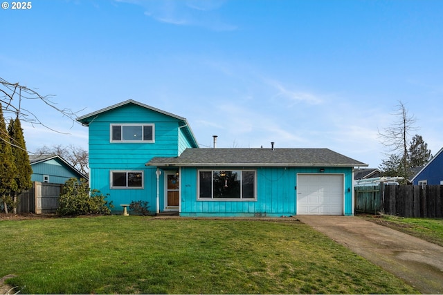 view of front property with a garage and a front lawn