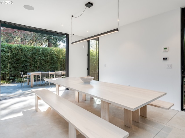 dining area featuring floor to ceiling windows