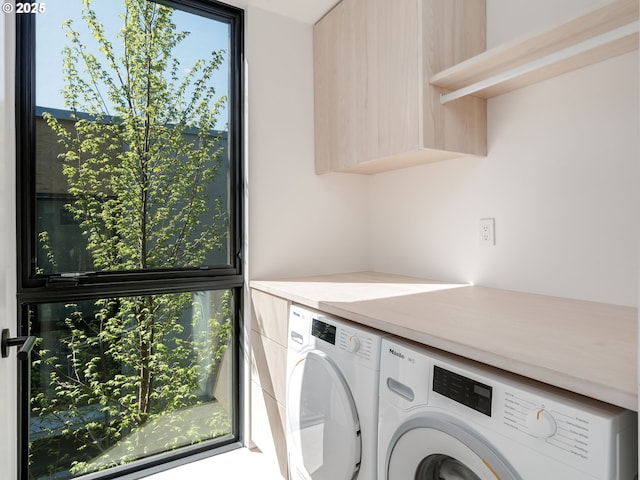 washroom with separate washer and dryer