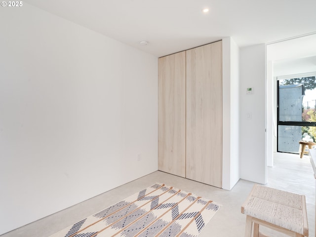 unfurnished bedroom featuring a closet and recessed lighting