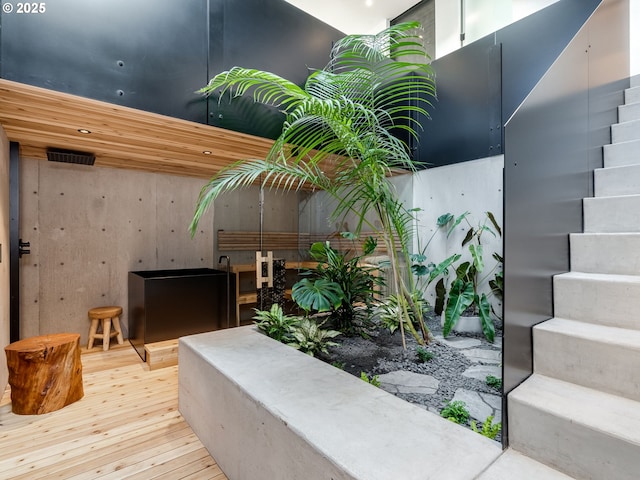 staircase with hardwood / wood-style floors