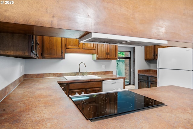 kitchen with white appliances, a sink, open shelves, and light countertops