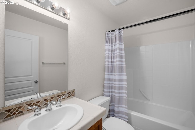 full bathroom with toilet, shower / bath combo with shower curtain, and vanity