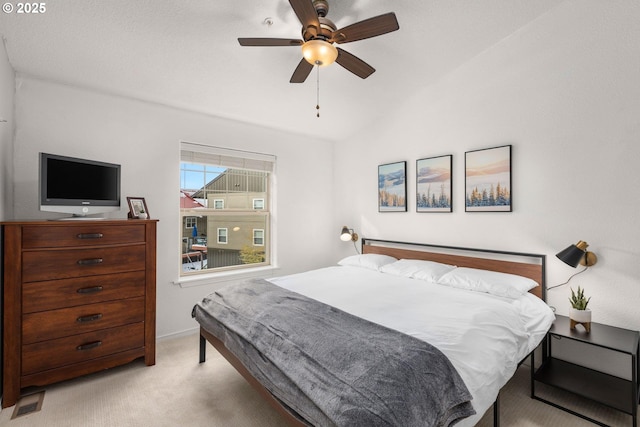 bedroom featuring carpet floors, visible vents, lofted ceiling, baseboards, and a ceiling fan