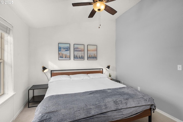 bedroom featuring baseboards, ceiling fan, and carpet