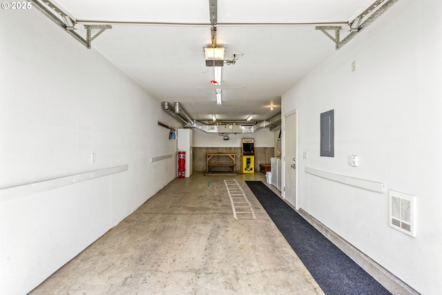 garage with visible vents and electric panel