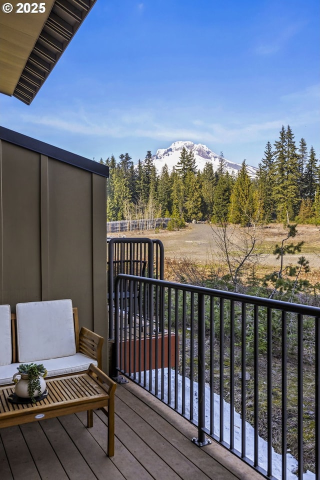 balcony with a mountain view and a wooded view