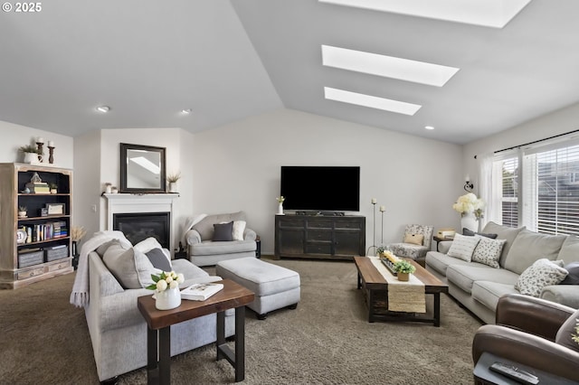 1537 W 13th Ave, Junction City, OR 97448 - living area featuring lofted ceiling, a skylight, carpet floors, and a glass covered fireplace