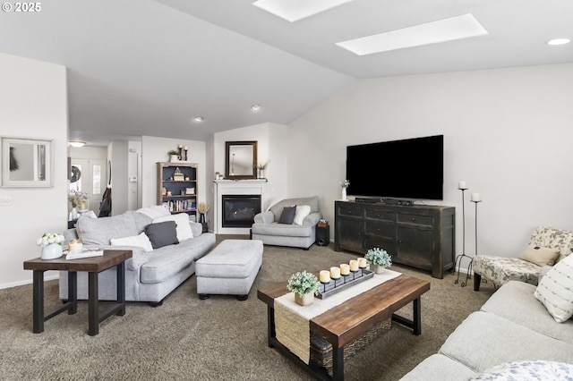 1537 W 13th Ave, Junction City, OR 97448 - carpeted living room featuring lofted ceiling, a skylight, a glass covered fireplace, and recessed lighting