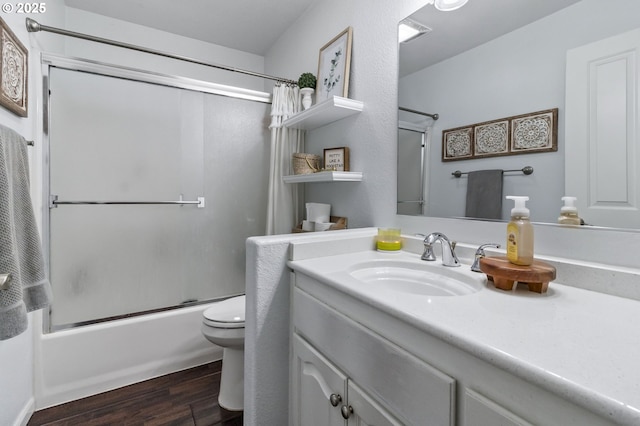 1537 W 13th Ave, Junction City, OR 97448 - full bathroom featuring wood finished floors, shower / bath combination with glass door, and vanity
