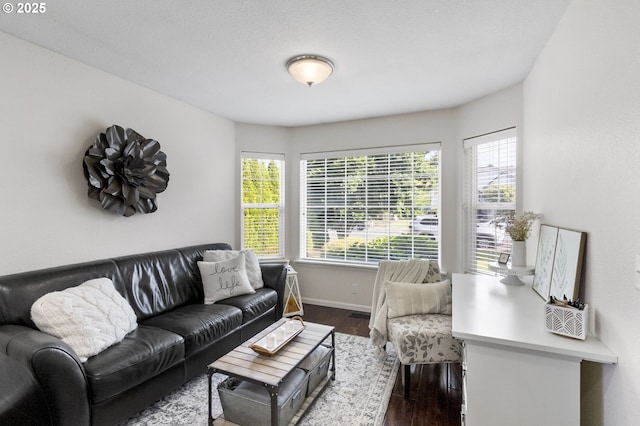 1537 W 13th Ave, Junction City, OR 97448 - living area featuring dark wood-style floors and baseboards
