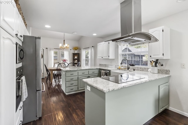 1537 W 13th Ave, Junction City, OR 97448 - kitchen with island exhaust hood, a peninsula, plenty of natural light, dark wood-type flooring, and recessed lighting
