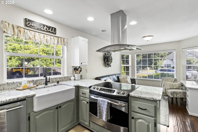 1537 W 13th Ave, Junction City, OR 97448 - kitchen featuring appliances with stainless steel finishes, open floor plan, a peninsula, island range hood, and recessed lighting