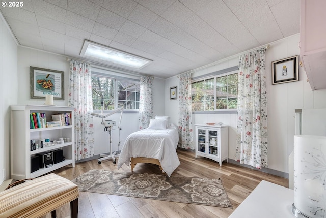 bedroom with wood finished floors