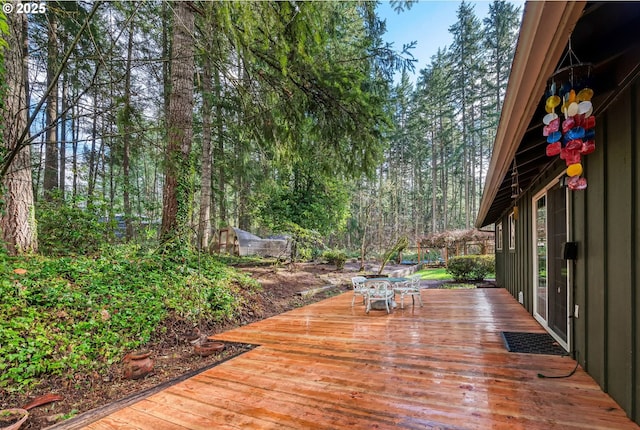 wooden deck with outdoor dining space