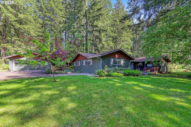 ranch-style home featuring a front lawn and board and batten siding