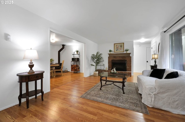 living room featuring a fireplace and wood finished floors