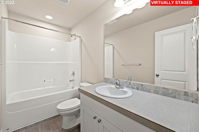 full bathroom with shower / tub combination, vanity, and toilet