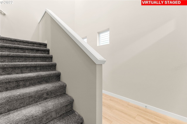 stairway with wood-type flooring